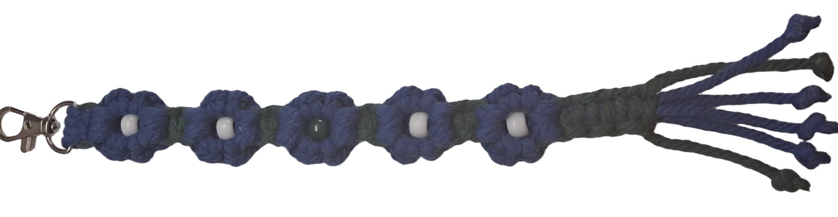 Nice 5 flower blue and green macrame daisy Keychain on light gray background 